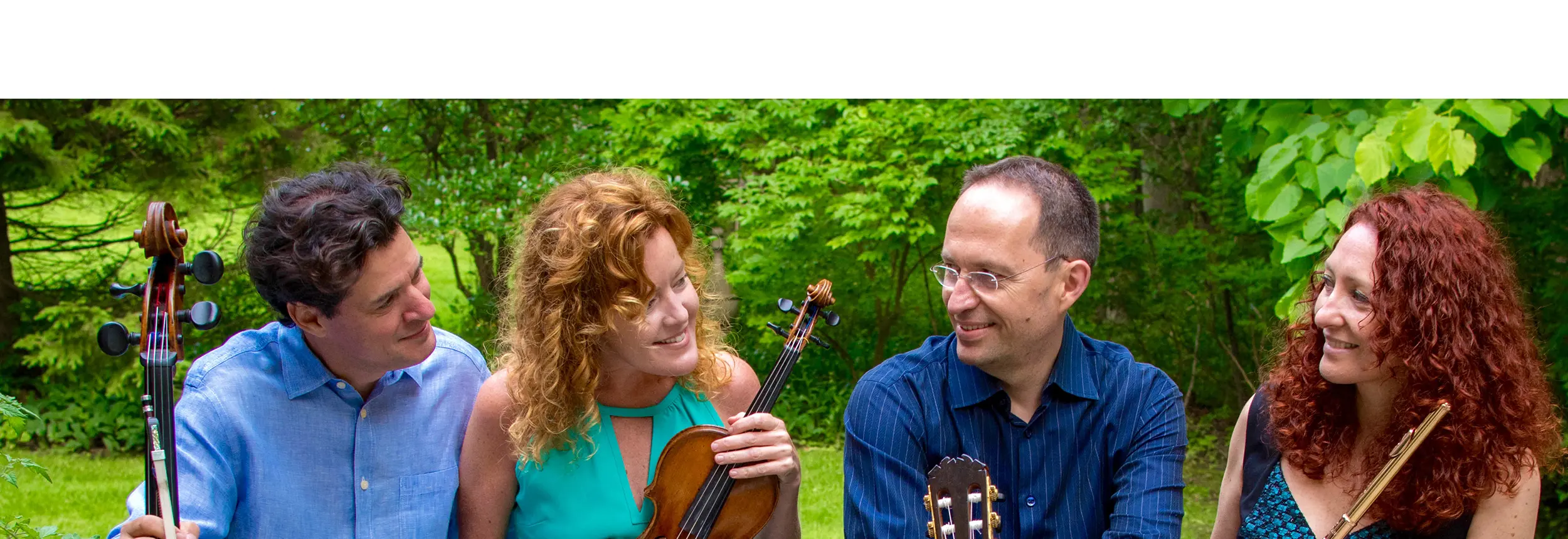 Fandango! members sitting on bench with instruments.