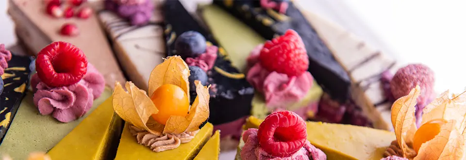 Colorful selection of vegan raw cakes 